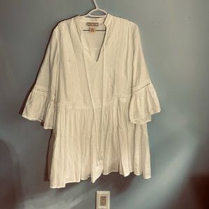 White tiered mini-dress with lace detailing, fully lined. Size L.